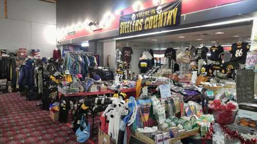 A vibrant store display filled with Pittsburgh Steelers merchandise, clothing, and various items for fans.