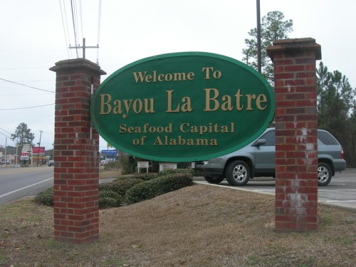 Welcome sign for Bayou La Batre, Alabama, highlighting it as the Seafood Capital of Alabama.