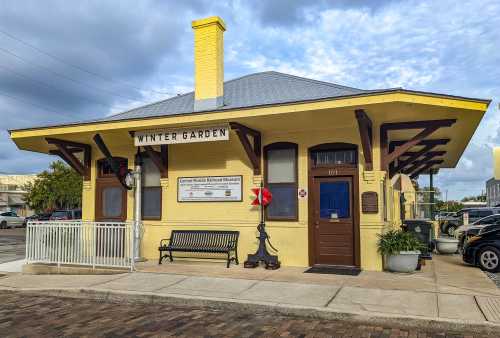 Historic yellow train station building with a sign for the Central Florida Railroad Museum in Winter Garden.