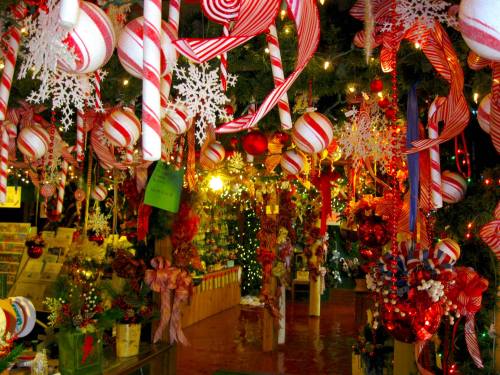 A festive display of red and white candy canes, ornaments, and snowflakes, creating a cheerful holiday atmosphere.