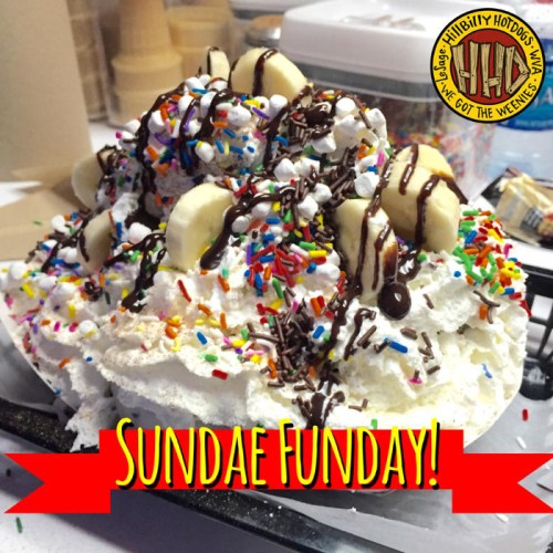 A large, colorful ice cream sundae topped with whipped cream, bananas, chocolate syrup, and sprinkles. Text: "Sundae Funday!"
