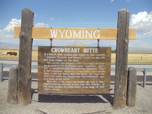 Sign marking Crowheart Butte in Wyoming, detailing the 1866 battle between Shoshone, Bannock, and Crow tribes.