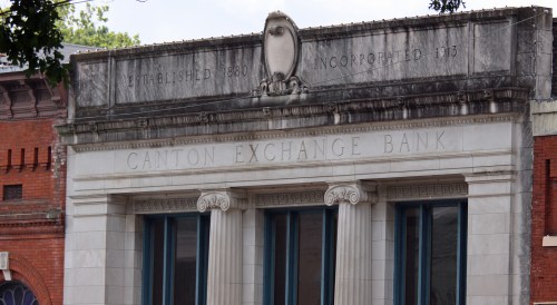 Historic Canton Exchange Bank building with decorative architecture, featuring the year established and incorporated.