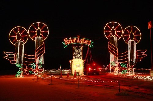 Colorful holiday lights form large candles and the words "Nite Lites" against a dark night sky.