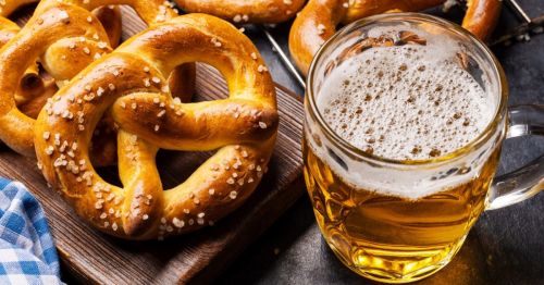 close up photo of beer and pretzels from a beer hall