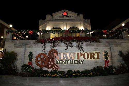 A festive building in Newport, Kentucky, adorned with holiday decorations and a large sign.