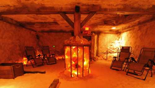 A cozy salt room with glowing salt blocks, wooden beams, and reclining chairs for relaxation. Warm, ambient lighting.