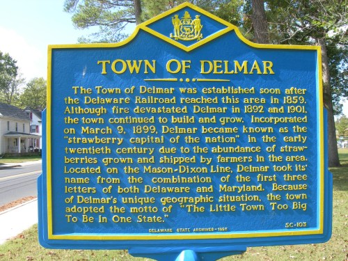 Sign for "Town of Delmar," detailing its history, incorporation, and significance as the "strawberry capital of the nation."