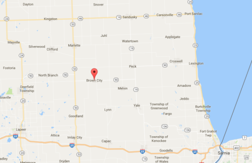 Map showing the location of Brown City in Michigan, marked with a red pin. Nearby towns and highways are also visible.