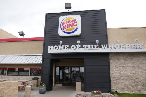 Exterior of a Burger King restaurant featuring the sign "Home of the Whopper" and a modern design.