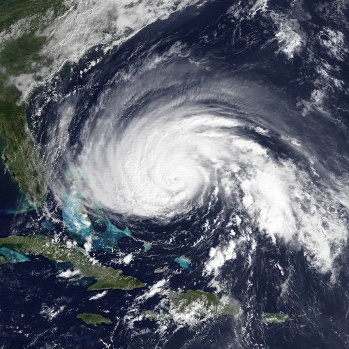 Satellite image of a powerful hurricane swirling over the Atlantic Ocean, near the eastern coast of the United States.