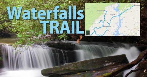 A serene waterfall scene with a map inset showing the Waterfalls Trail route. Lush greenery surrounds the water.