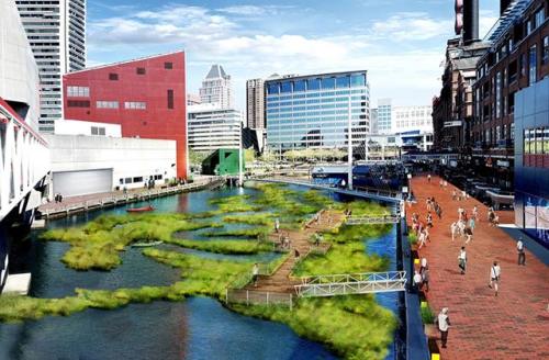 A vibrant urban waterfront with green spaces, walkways, and people enjoying the area near modern buildings.