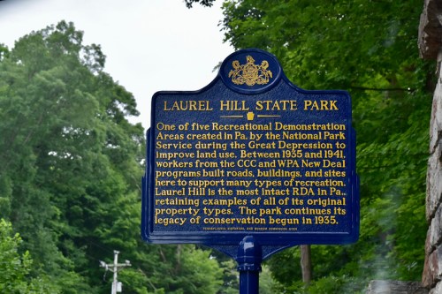 A historical marker for Laurel Hill State Park, detailing its creation and significance during the Great Depression.