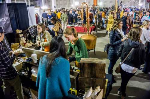 A bustling market scene with vendors and shoppers, showcasing handmade goods and a lively atmosphere.