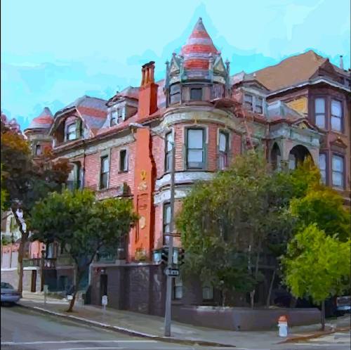 Colorful Victorian-style building with ornate turrets and lush greenery on a street corner.