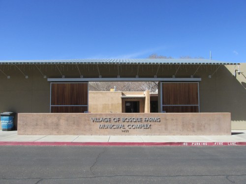 Exterior view of the Village of Bosque Farms Municipal Complex, featuring a modern design and clear blue sky.