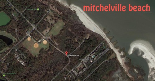 Aerial view of Mitchelville Beach, showing nearby fields and roads along the coastline.