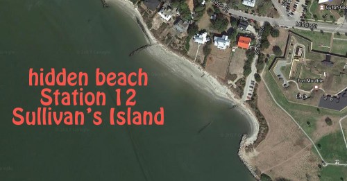 Aerial view of a hidden beach at Station 12 on Sullivan's Island, featuring sandy shores and nearby buildings.