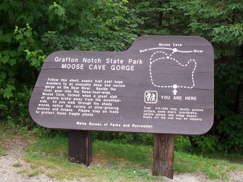 Sign at Grafton Notch State Park detailing Moose Cave Gorge trail and safety information.