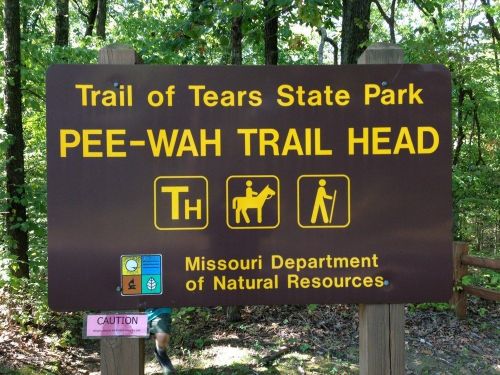 Sign for Pee-Wah Trail Head at Trail of Tears State Park, featuring icons for hiking and horseback riding.