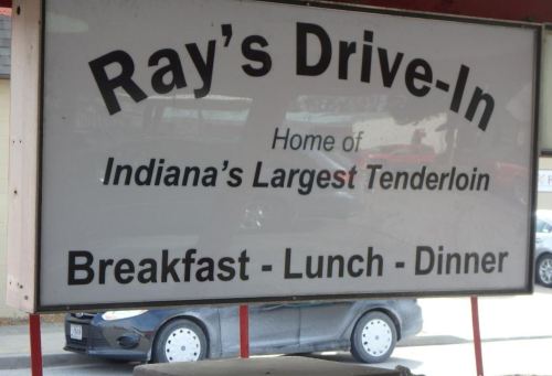 Sign for Ray's Drive-In, advertising "Indiana's Largest Tenderloin" and serving breakfast, lunch, and dinner.