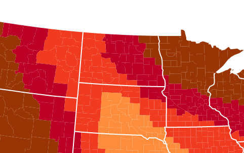 Map showing varying shades of red and orange across the northern United States, indicating temperature or climate zones.