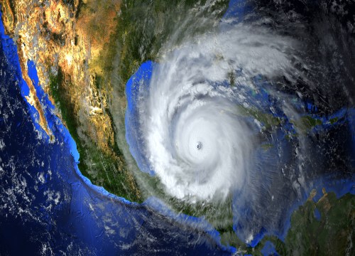 Satellite view of a massive hurricane approaching the American continent from space, with NASA image elements.