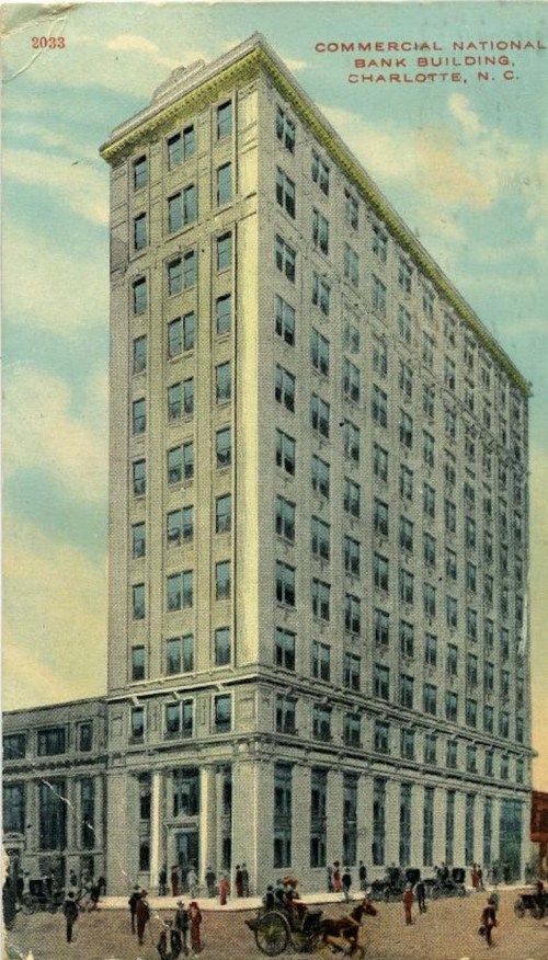 Historic postcard of the Commercial National Bank Building in Charlotte, N.C., featuring a tall, ornate structure.