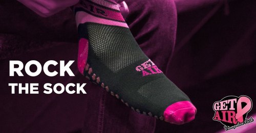 A close-up of a black and pink sock with "GET AIR" branding, promoting a fun and active lifestyle.