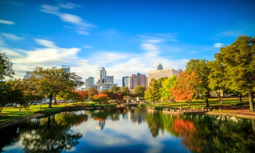 Skyline of downtown Charlotte, North Carolina, with skyscrapers and city buildings under a clear sky