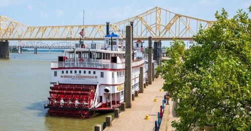 View of Ohio River Steamboat in Kentucky on a sunny day with the bridge in the background