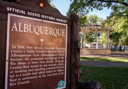 Historic marker for Albuquerque, detailing its founding in 1706 and significance in farming and ranching.
