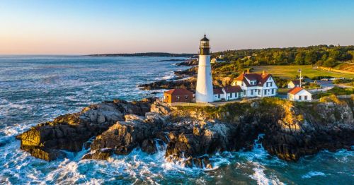 Aerial view of the Maine waterfront and lighthouse