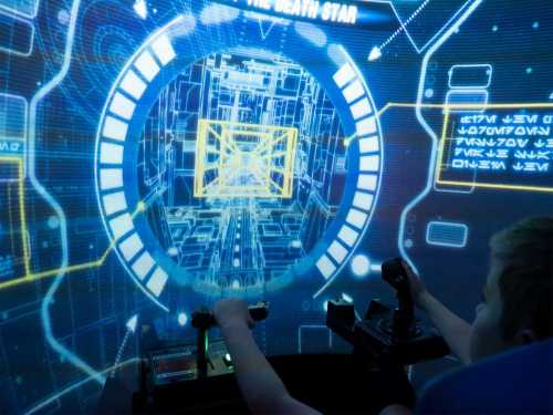A person interacts with a futuristic control panel, surrounded by a digital display of a space-themed interface.