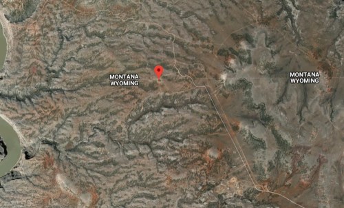 Map showing a remote area in Montana and Wyoming, with a red marker indicating a specific location.