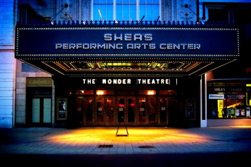 The illuminated entrance of Shea's Performing Arts Center, featuring "The Wonder Theatre" marquee at dusk.
