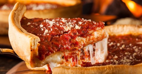 a slice of deep dish pizza with tomato and cheese