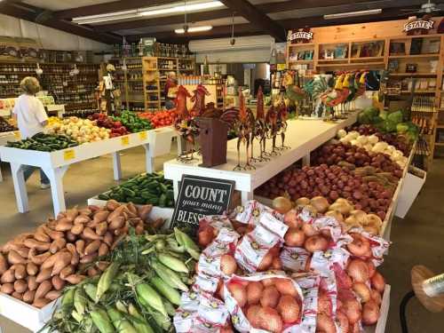 A vibrant farm stand filled with fresh produce, including potatoes, corn, and peppers, alongside decorative roosters.