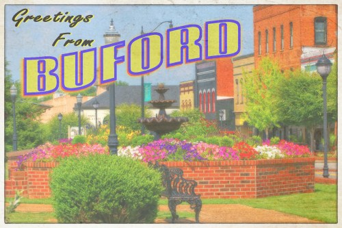 A vibrant postcard-style image featuring a fountain and colorful flowers in a park setting, with "Greetings From Buford" text.