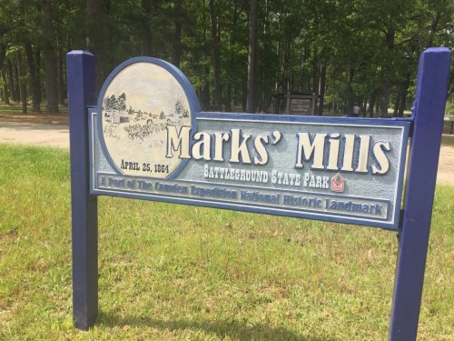 Sign for Marks' Mills Battleground State Park, featuring historical details and a date of April 25, 1864.