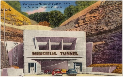 Vintage postcard depicting the entrance to Memorial Tunnel on the West Virginia Turnpike, featuring classic cars.