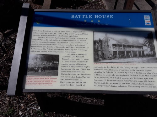 Image of a historical plaque titled "Battle House," detailing its significance during the Civil War and surrender events.