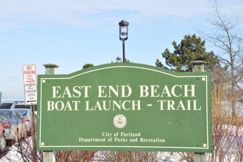 Sign for East End Beach Boat Launch and Trail in Portland, with nearby parking regulations visible.