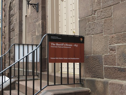 Sign at the Sheriff's House, established in 1857, indicating it as a visitor center and headquarters for a national monument.
