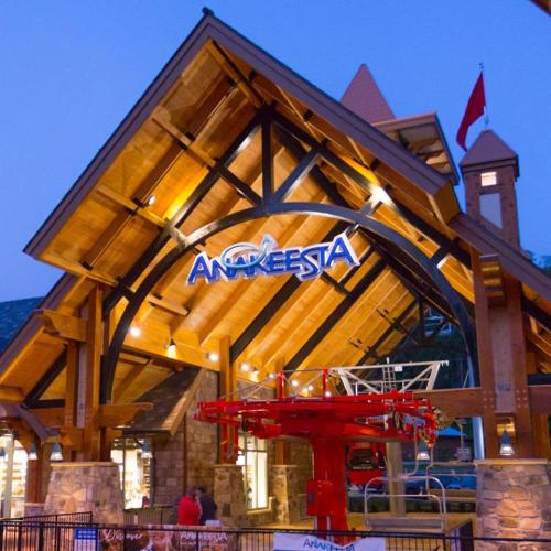 A wooden lodge with a peaked roof and the sign "Anakeesta," featuring a red chairlift in front.