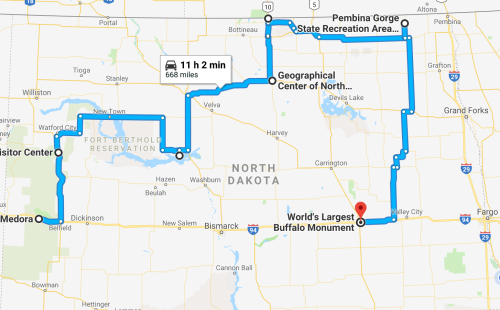 Map showing a road trip route in North Dakota, highlighting key stops like the World's Largest Buffalo Monument.