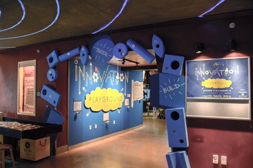 Entrance to an interactive space called "Innovation Playground," featuring colorful walls and playful design elements.