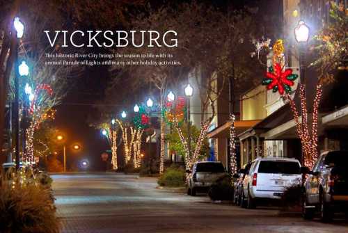 A festive street in Vicksburg, adorned with holiday lights and decorations, showcasing the annual Parade of Lights.