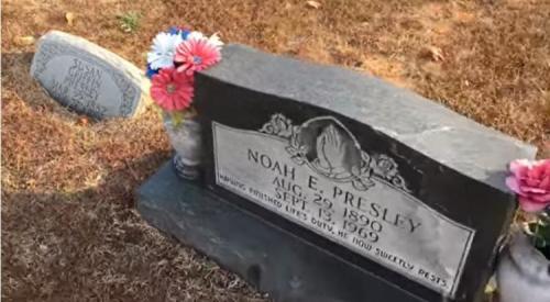 Gravestone of Noah E. Presley, born August 29, 1890, died September 12, 1960, adorned with flowers.